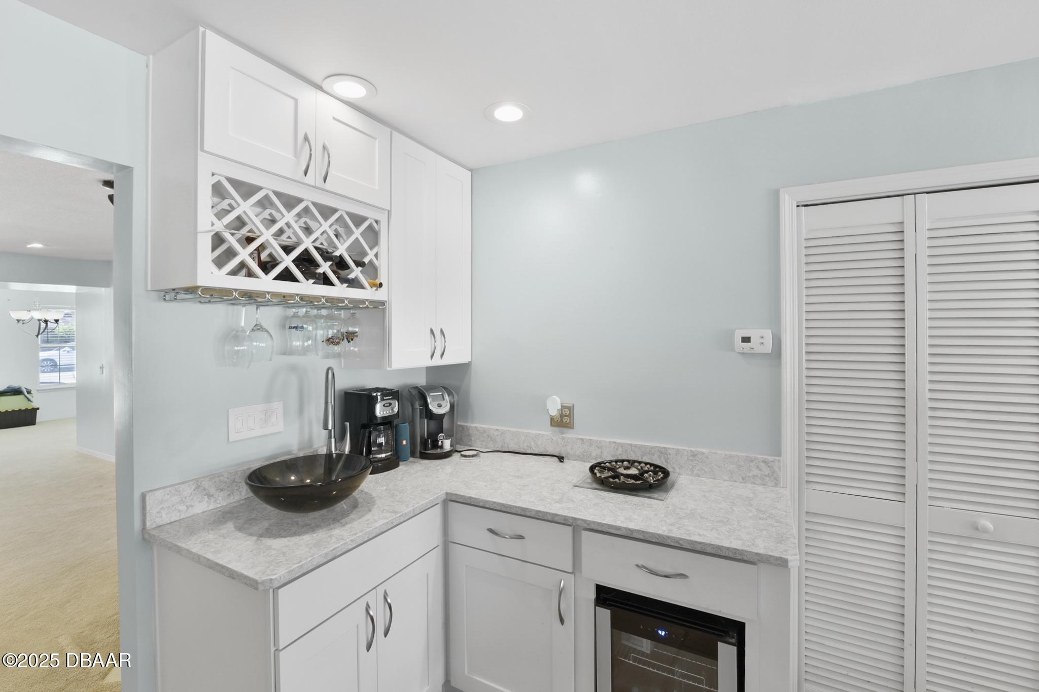 13 Fernery Trail Ormond Beach, FL 32174 - Photo 20 of 57 a kitchen with a cabinets and a stove