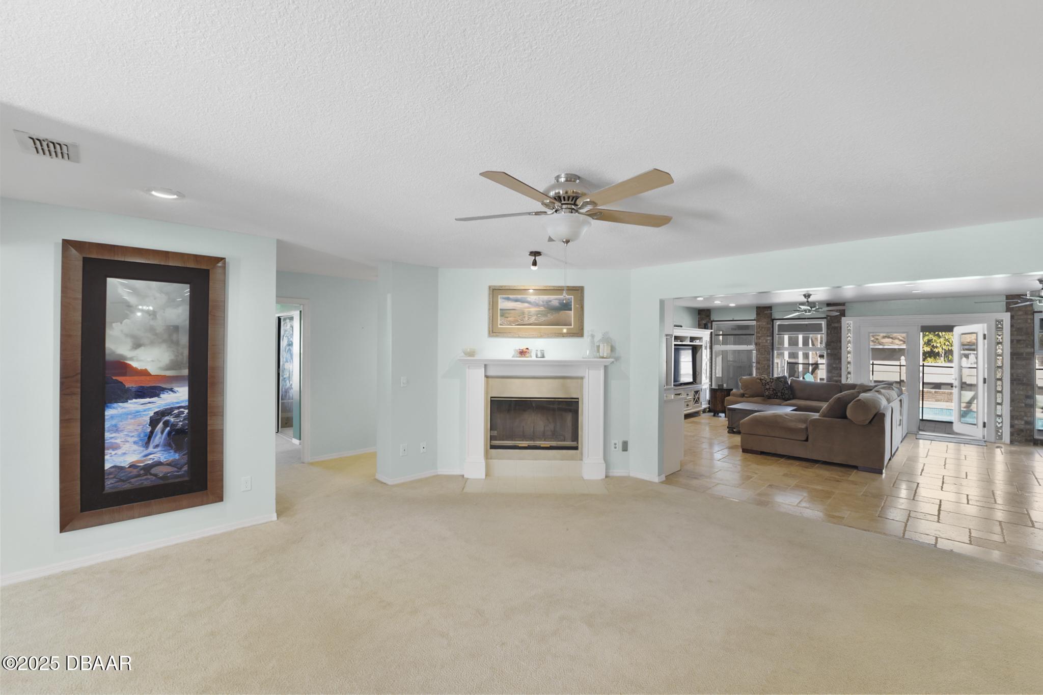 13 Fernery Trail Ormond Beach, FL 32174 - Photo 21 of 57 a living room with furniture and a ceiling fan