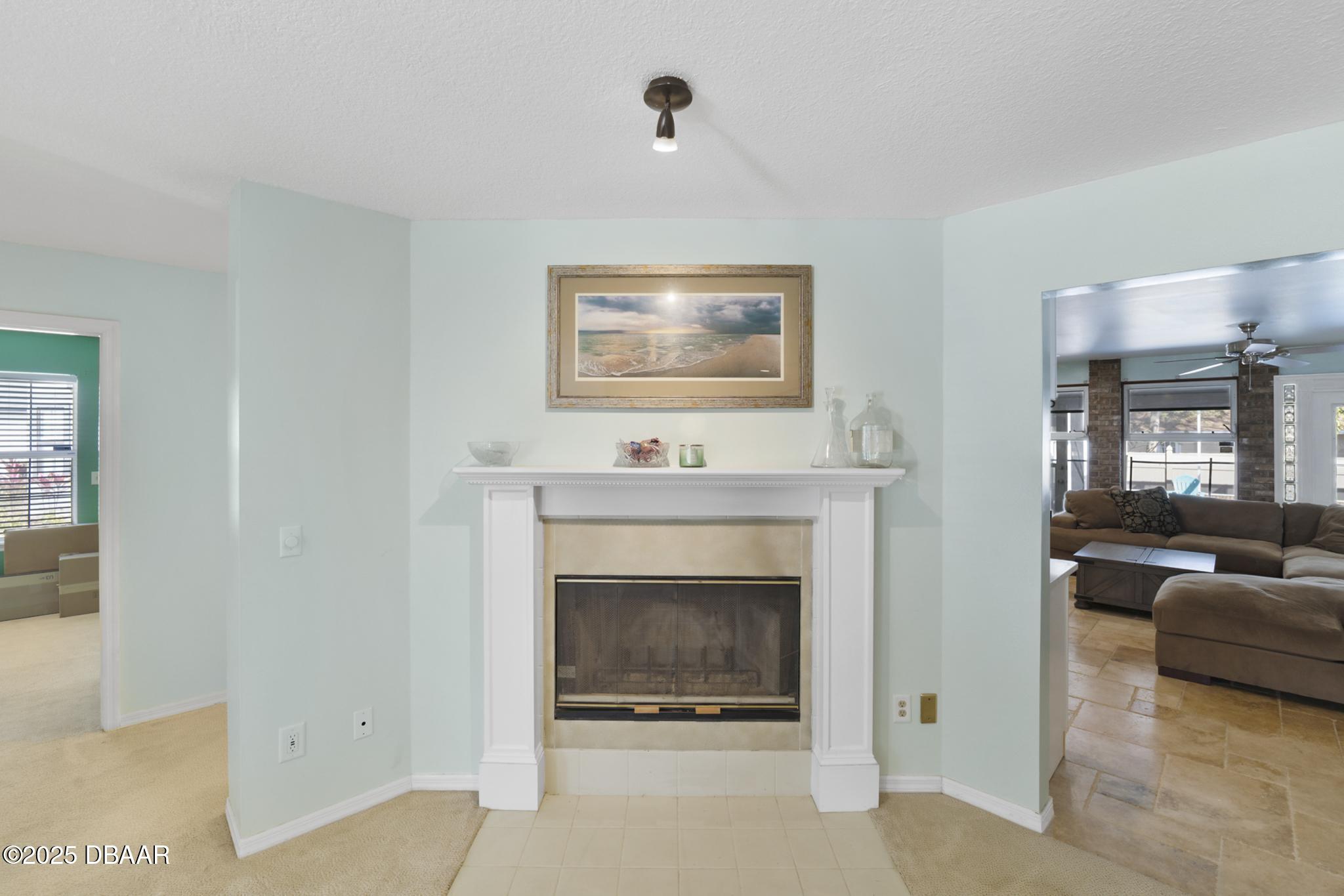 13 Fernery Trail Ormond Beach, FL 32174 - Photo 22 of 57 a living room with furniture and a fireplace