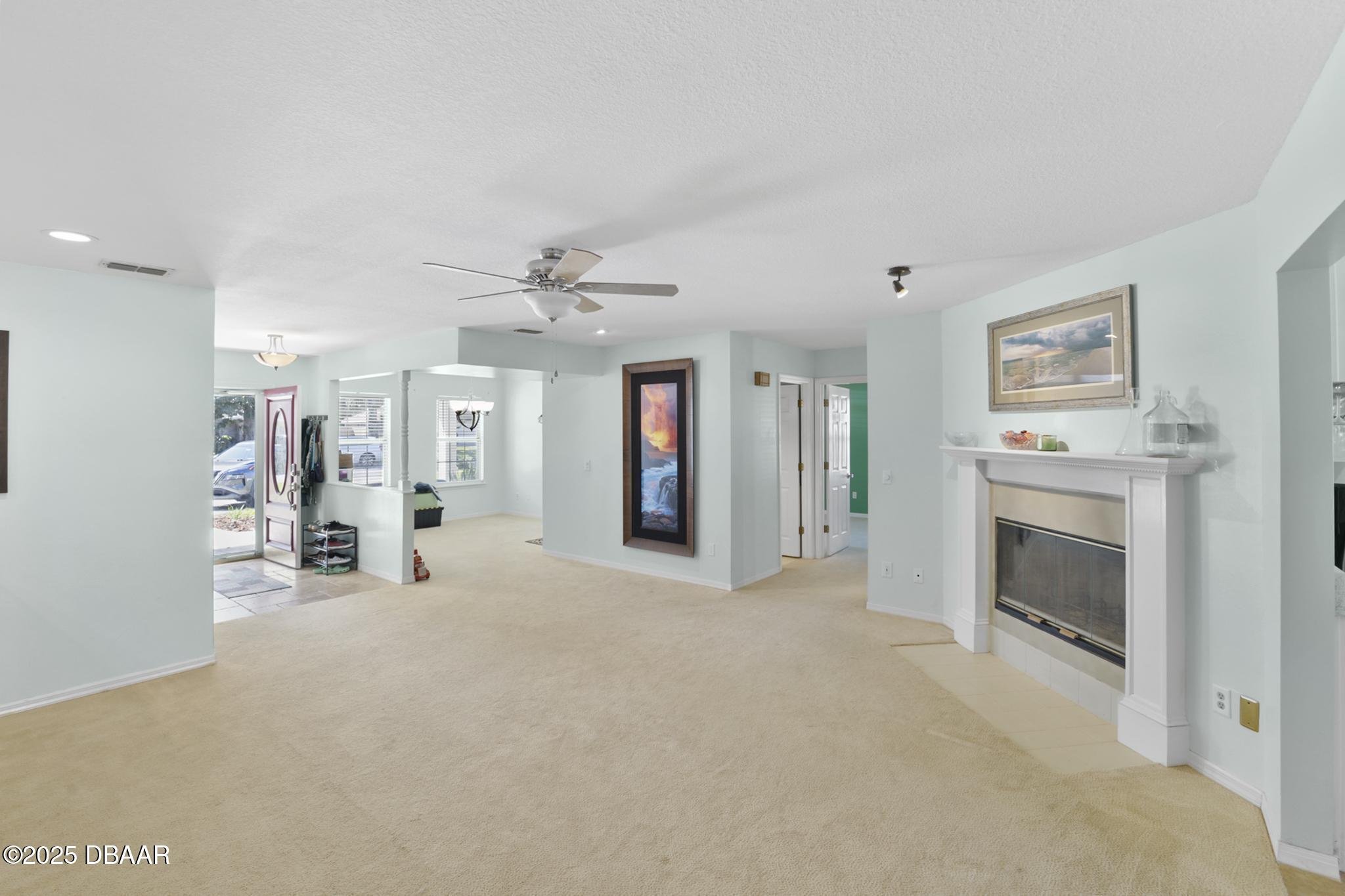 13 Fernery Trail Ormond Beach, FL 32174 - Photo 23 of 57 a view of a livingroom with an empty space and a fireplace