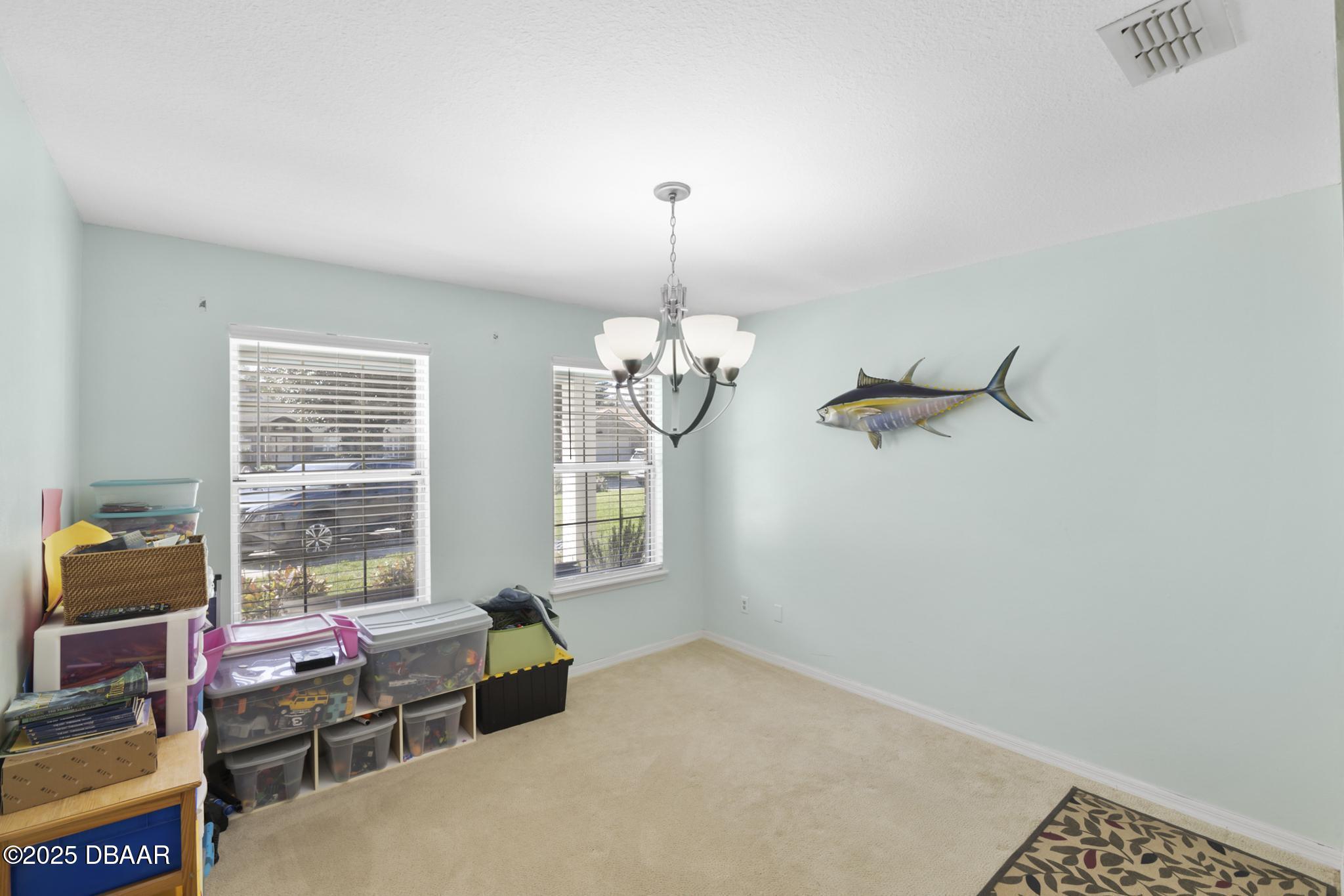 13 Fernery Trail Ormond Beach, FL 32174 - Photo 24 of 57 a bedroom with furniture and a window