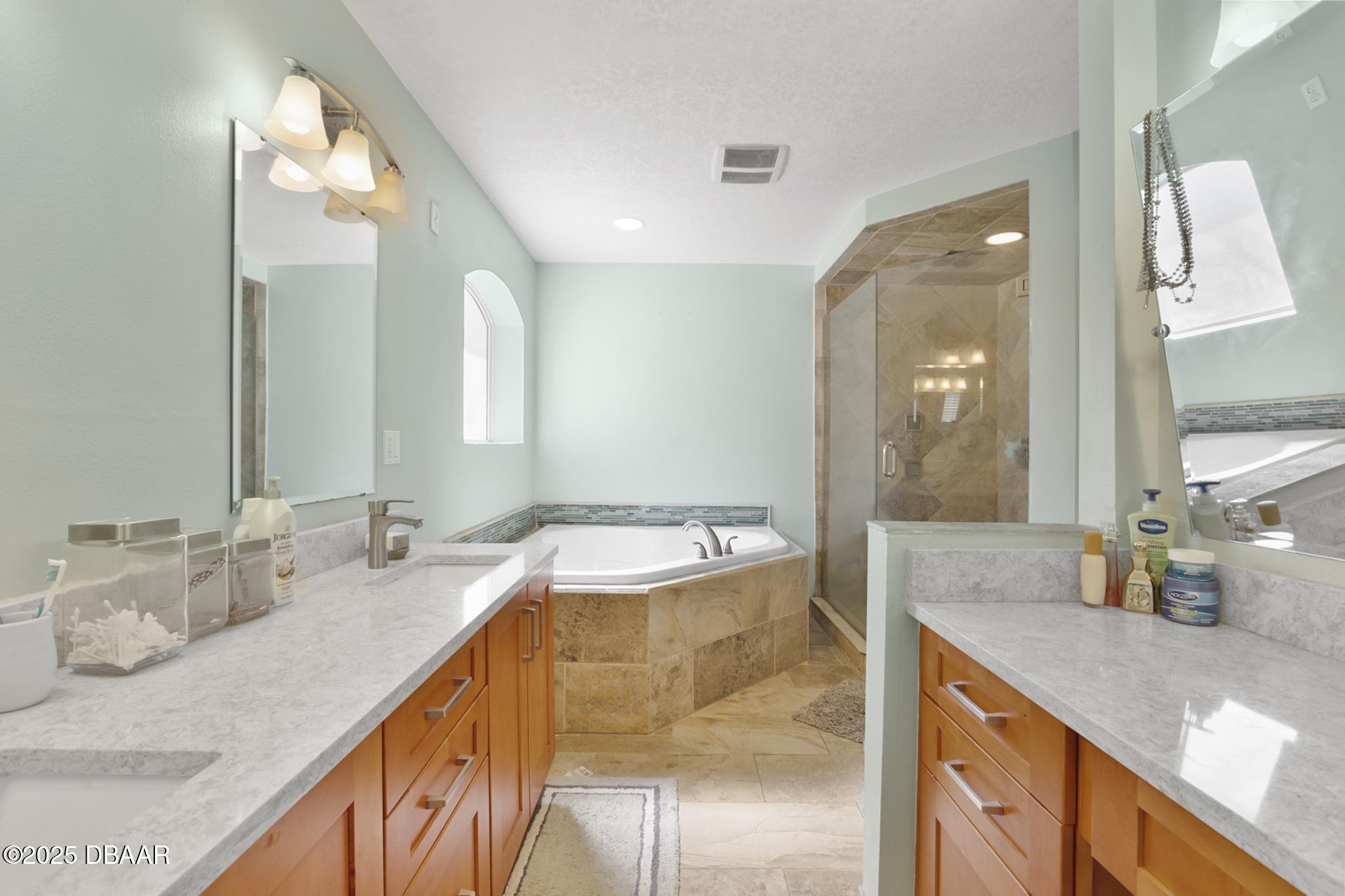 13 Fernery Trail Ormond Beach, FL 32174 - Photo 27 of 57 a bathroom with a granite countertop sink and a mirror