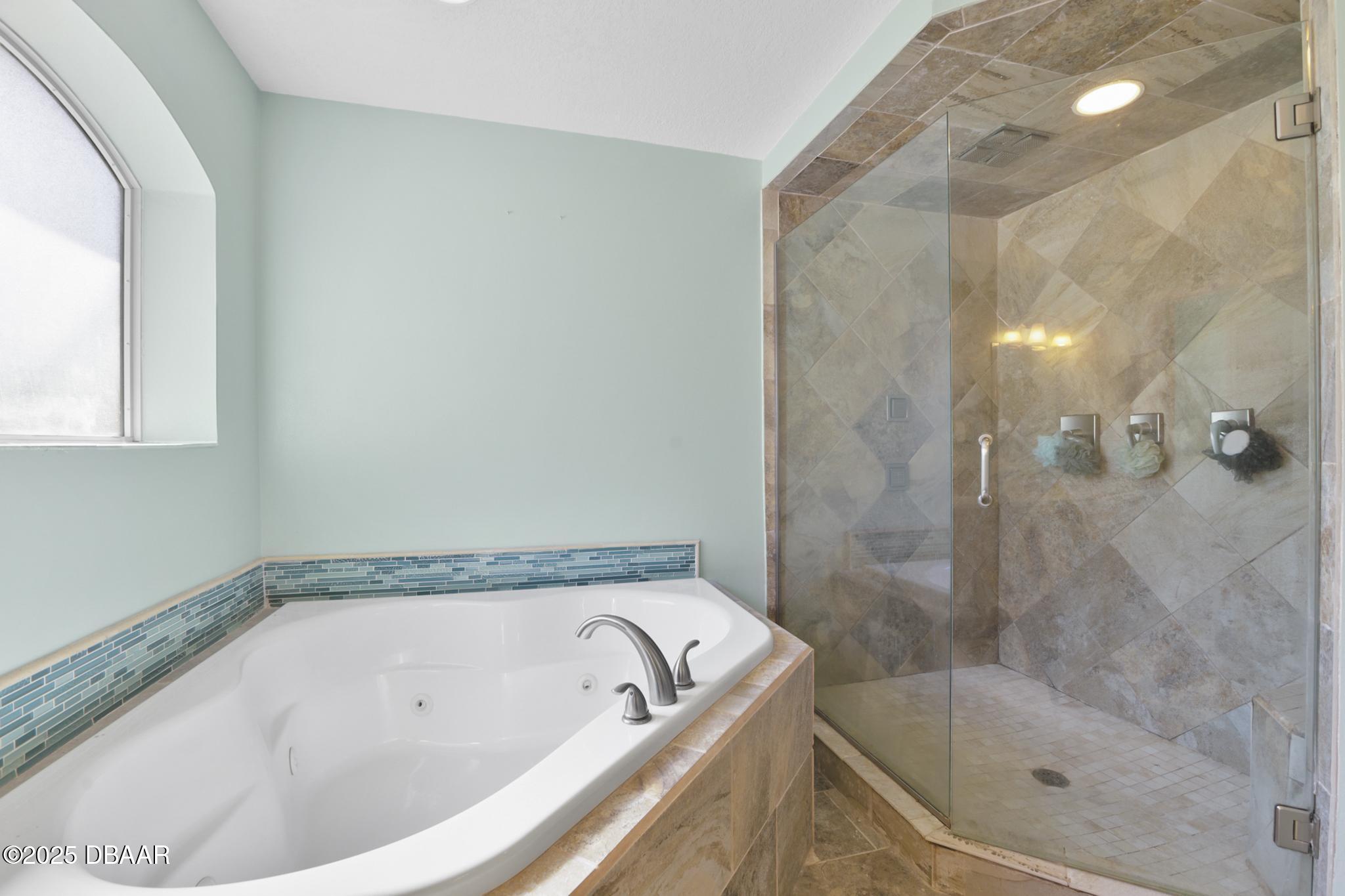13 Fernery Trail Ormond Beach, FL 32174 - Photo 28 of 57 a bath tub sitting next to a shower