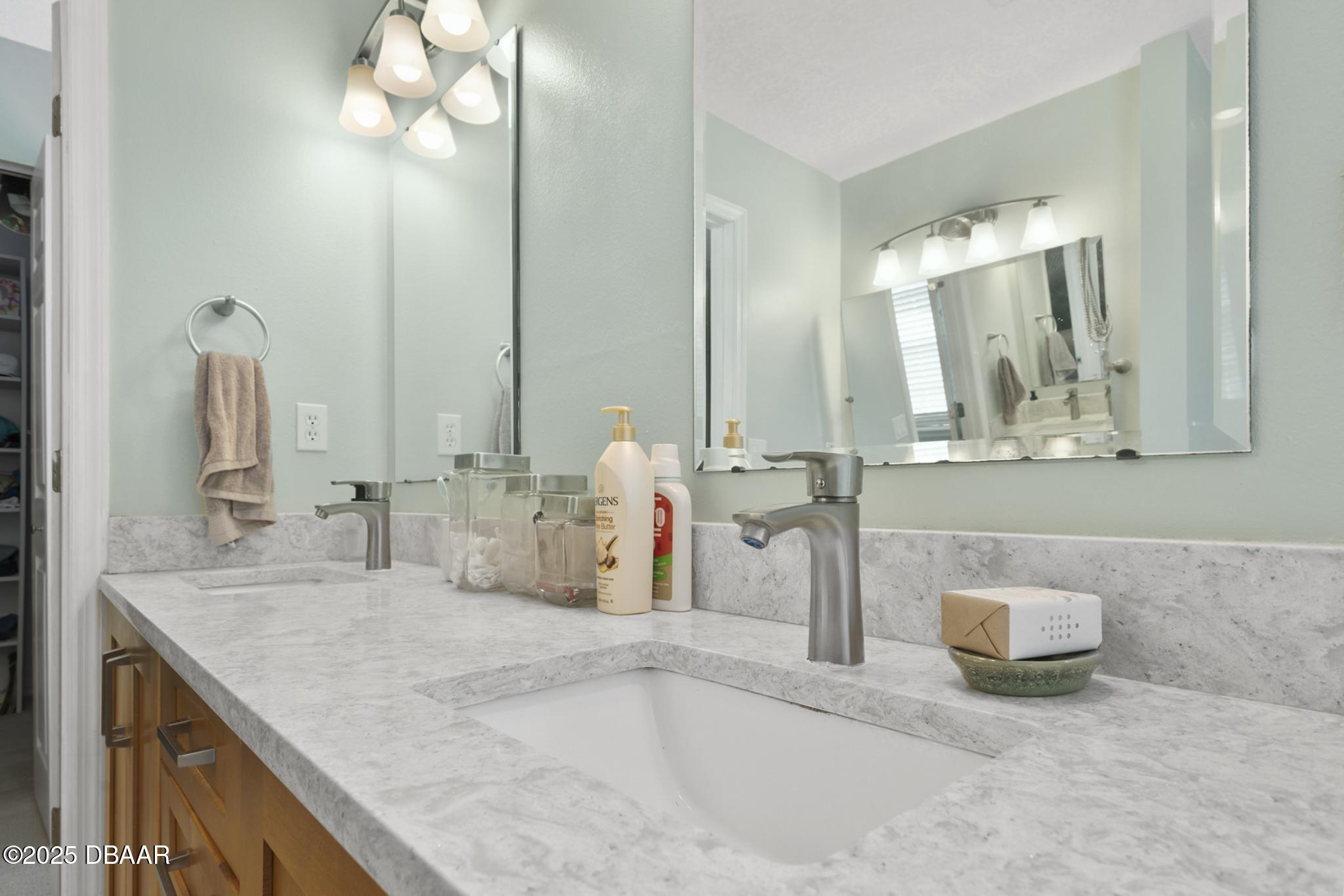13 Fernery Trail Ormond Beach, FL 32174 - Photo 29 of 57 a bathroom with a sink and a mirror