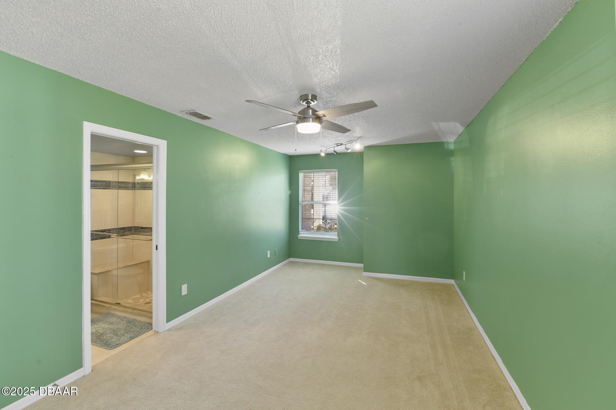 13 Fernery Trail Ormond Beach, FL 32174 - Photo 32 of 57 a view of a big room with windows and chandelier fan