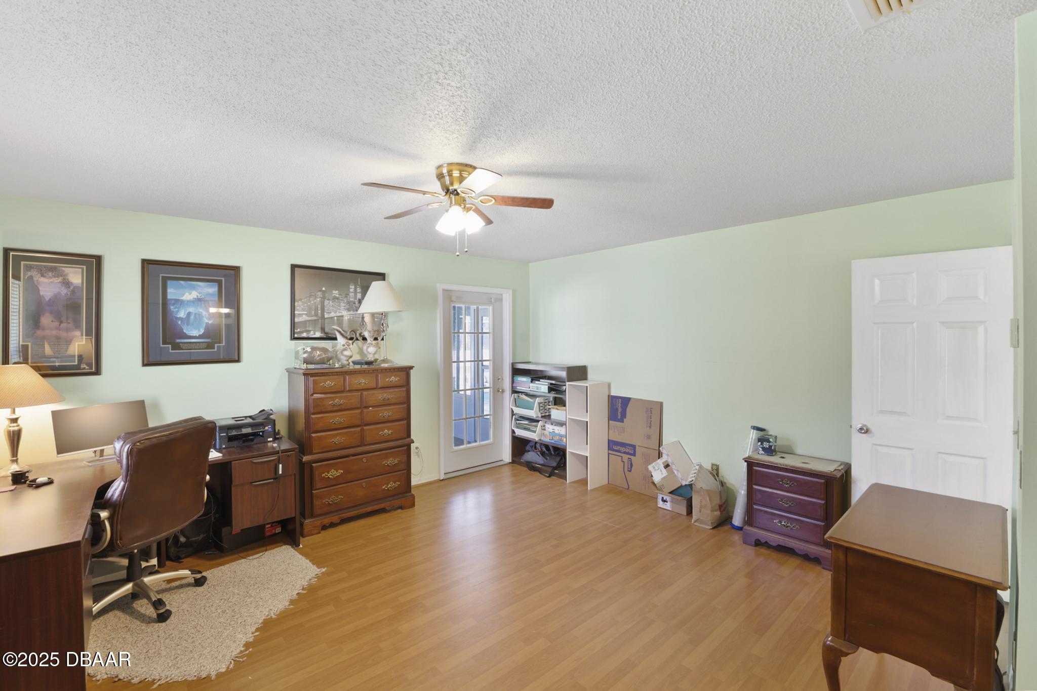 13 Fernery Trail Ormond Beach, FL 32174 - Photo 35 of 57 a view of a livingroom with workspace and a couch