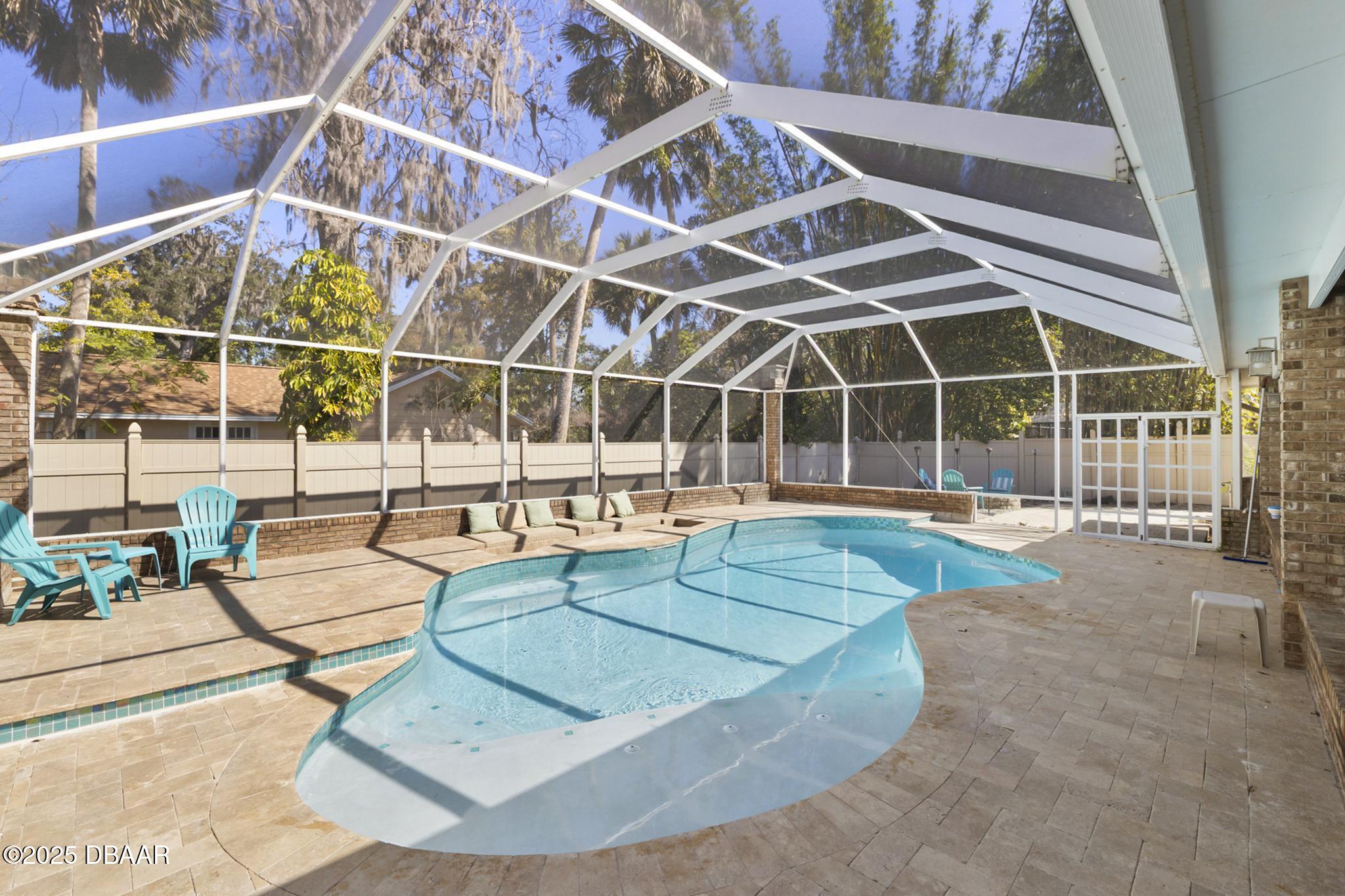13 Fernery Trail Ormond Beach, FL 32174 - Photo 42 of 57 a view of a swimming pool with outdoor seating