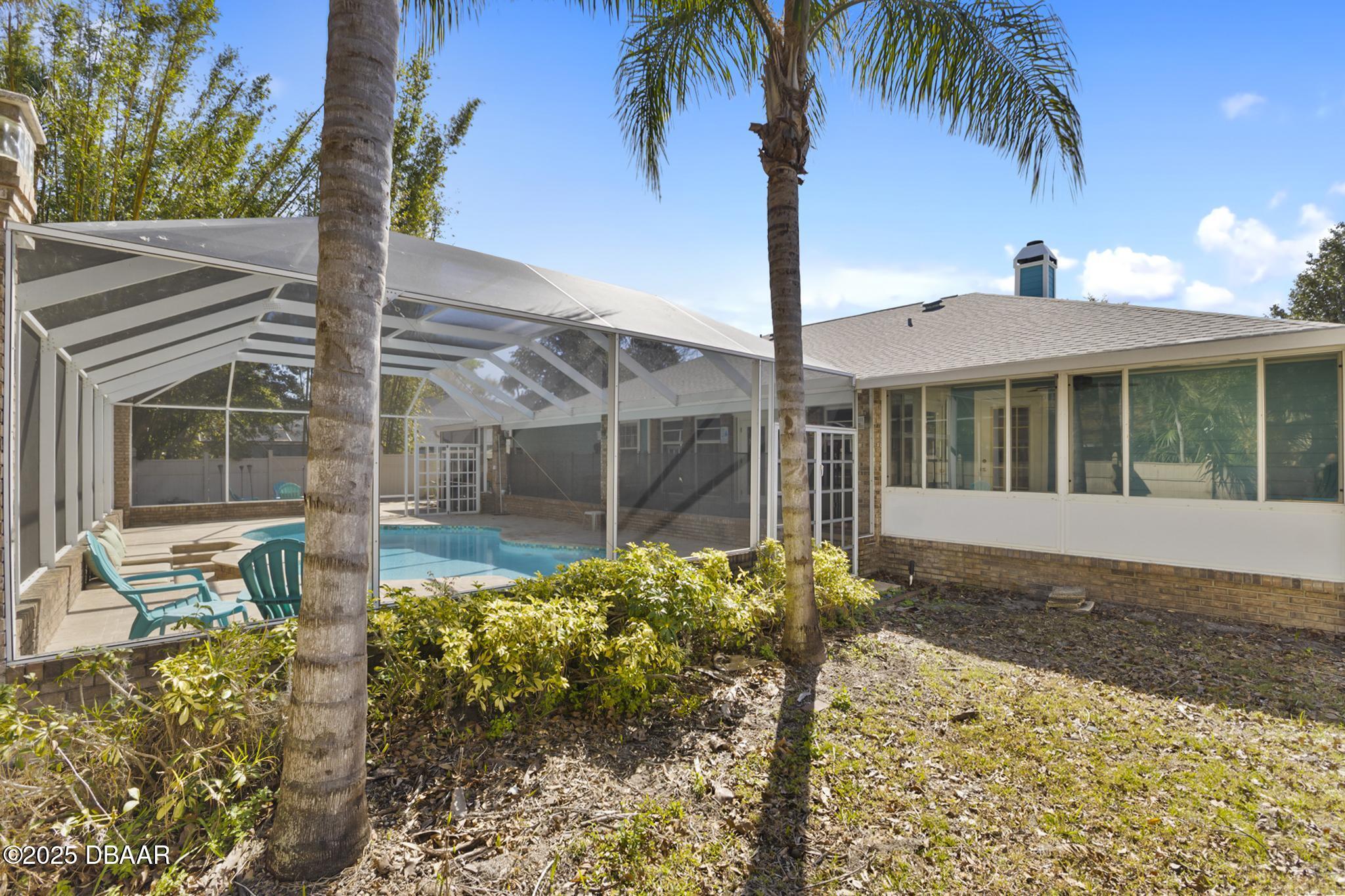 13 Fernery Trail Ormond Beach, FL 32174 - Photo 45 of 57 a front view of a house with garden
