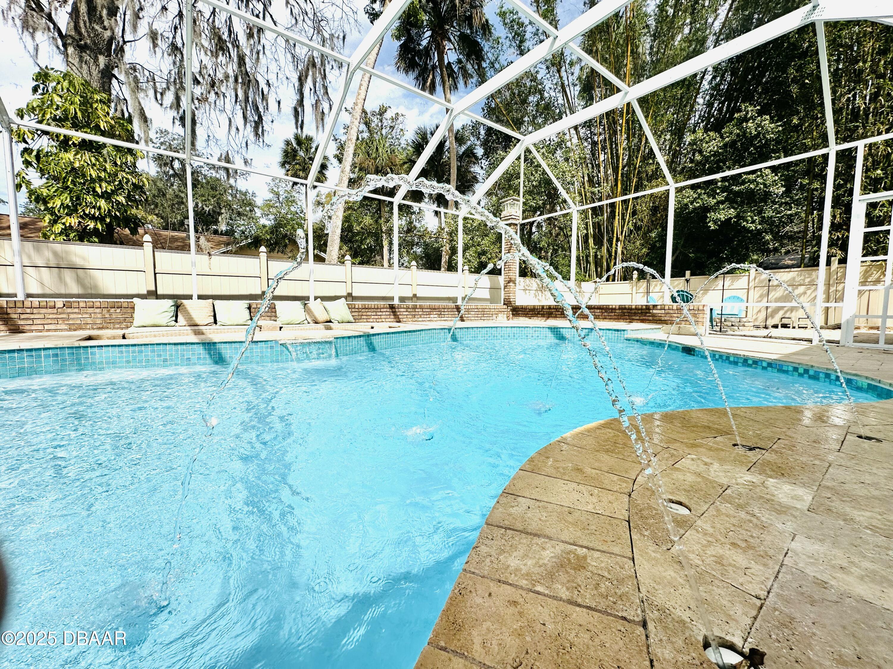 13 Fernery Trail Ormond Beach, FL 32174 - Photo 49 of 57 a view of a swimming pool with an outdoor seating
