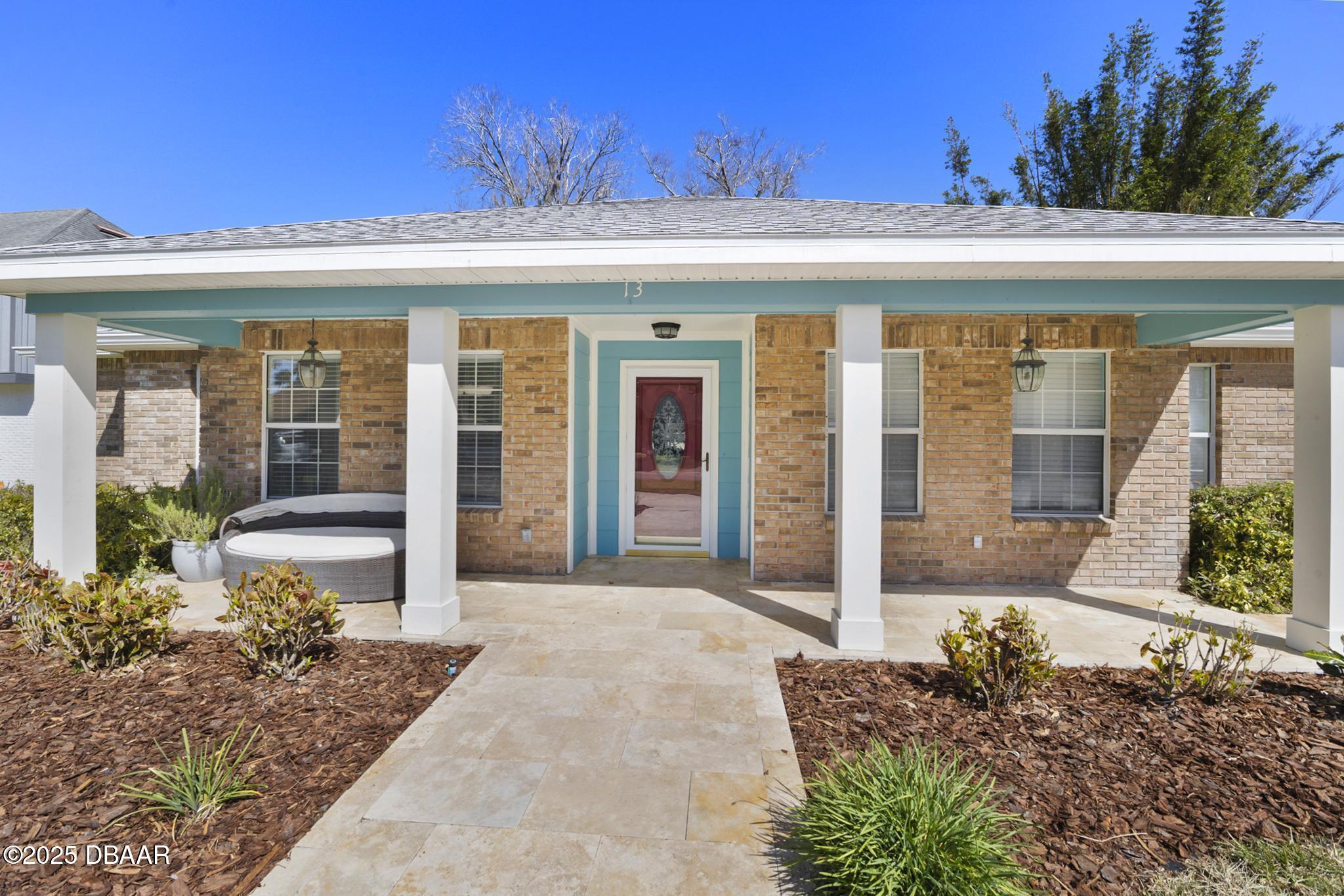 13 Fernery Trail Ormond Beach, FL 32174 - Photo 5 of 57 front view of a house with a large window