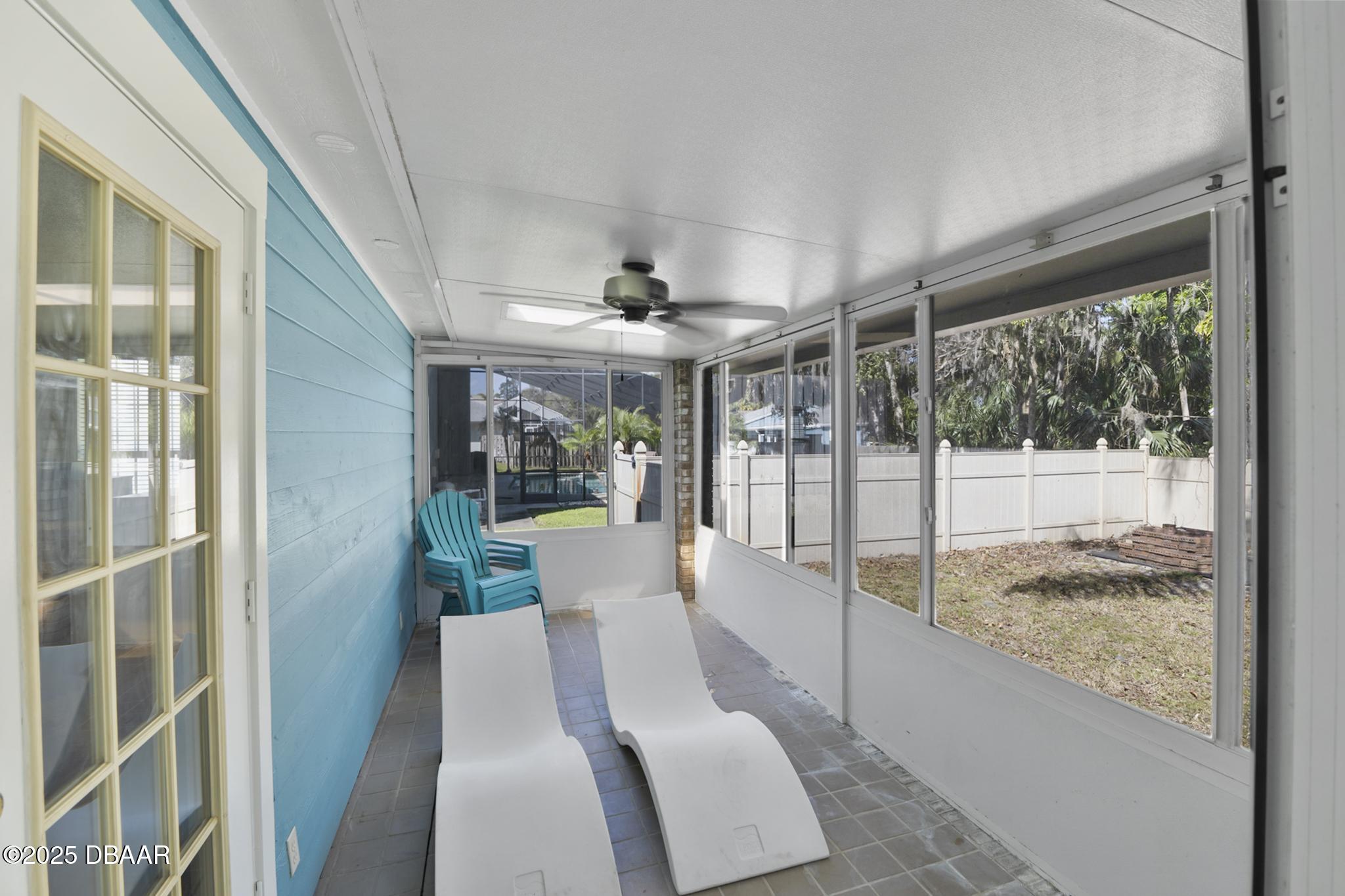 13 Fernery Trail Ormond Beach, FL 32174 - Photo 50 of 57 a view of a living room with furniture and floor to ceiling window