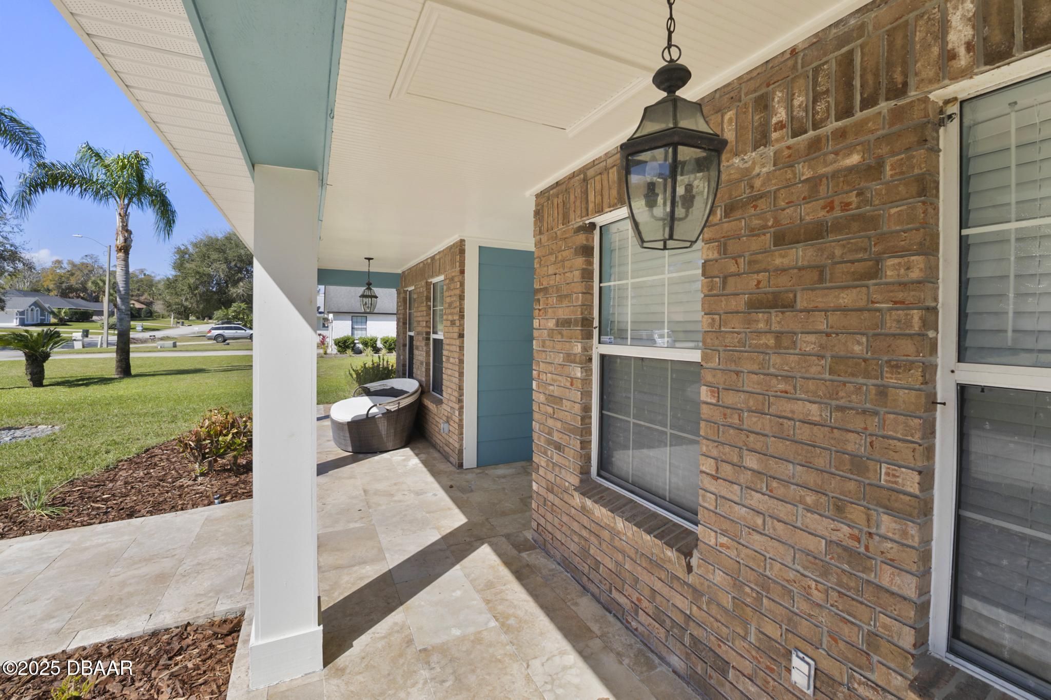 13 Fernery Trail Ormond Beach, FL 32174 - Photo 7 of 57 a view of a brick house with many windows
