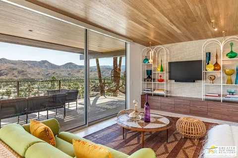 a living room with fireplace furniture and a flat screen tv