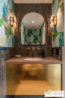 a view of a swimming pool with a lounge chair