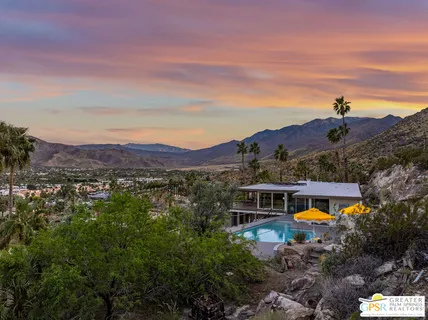 a view of entryway with a flower garden