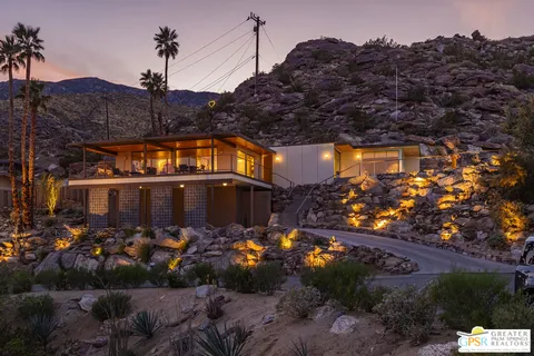 a view of a backyard with sitting area