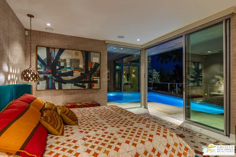 a sitting area with furniture and a garden