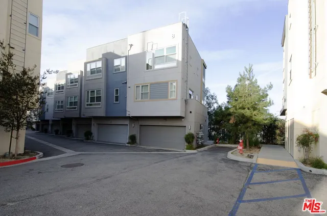 a view of a large building with a yard