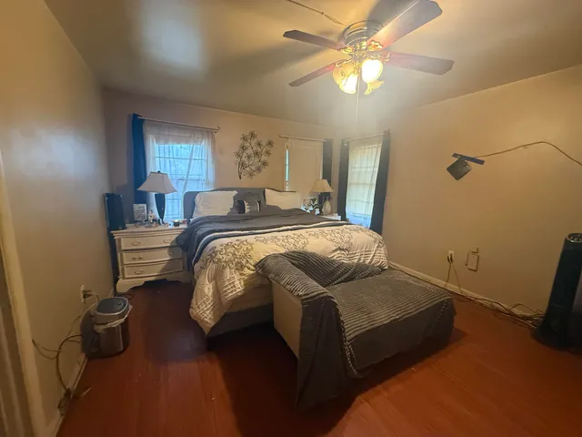 a bed room with a bed and a window