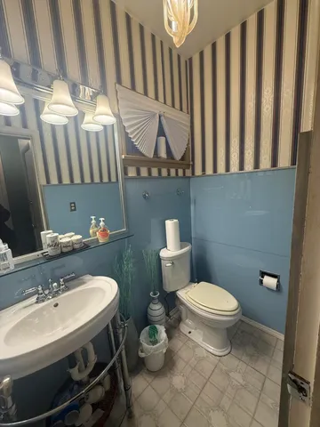 a view of gallery with wooden floor