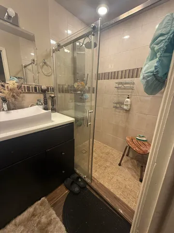 a bathroom with a sink mirror and toilet