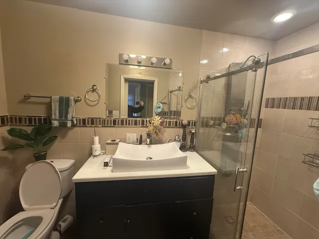 a utility room with a washing machine and a sink