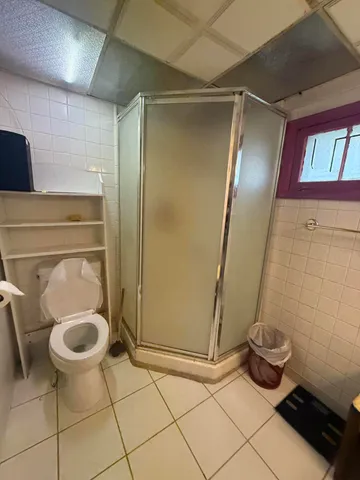 a room with gym equipment and a flat screen tv