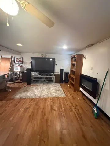 a view of a kitchen with furniture and a flat screen tv