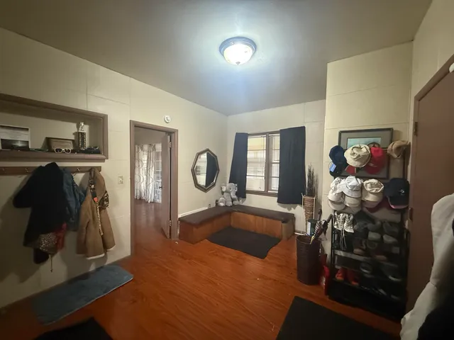 a view of a livingroom with furniture and a flat screen tv