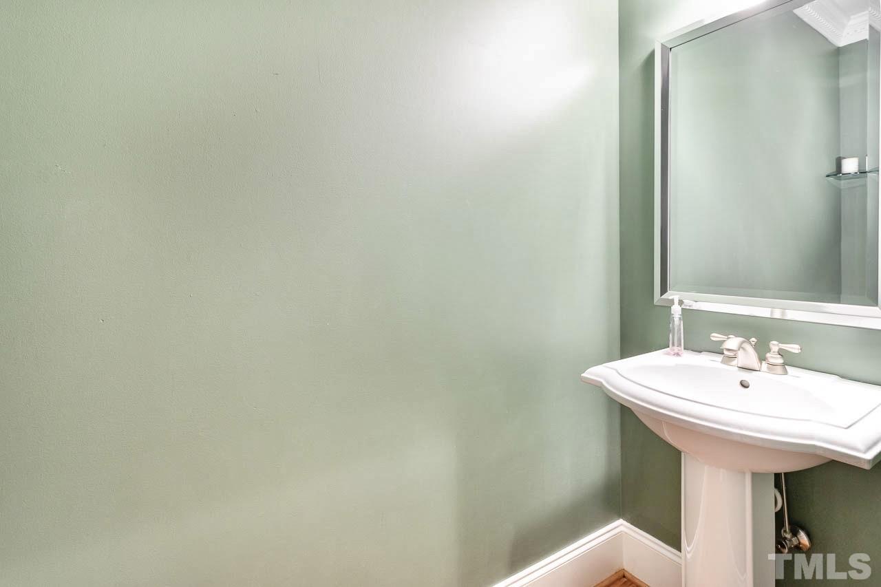 8333 Wheatstone Lane Raleigh, NC 27613 - Photo 13 of 34 a bathroom with a sink and a mirror