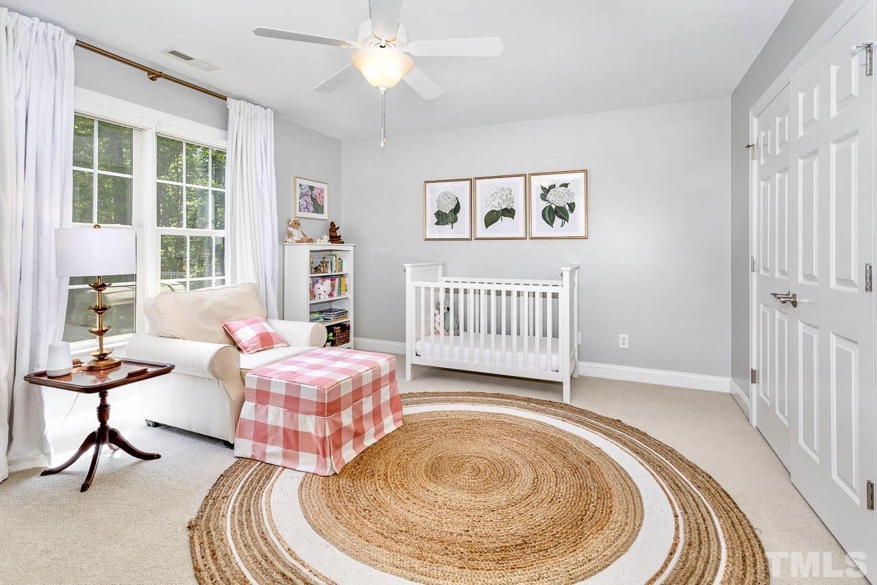8333 Wheatstone Lane Raleigh, NC 27613 - Photo 19 of 34 a room with furniture and a window