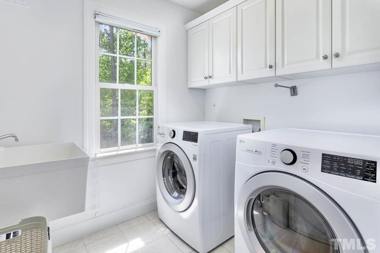 8333 Wheatstone Lane Raleigh, NC 27613 - Photo 24 of 34 a utility room with dryer and washer