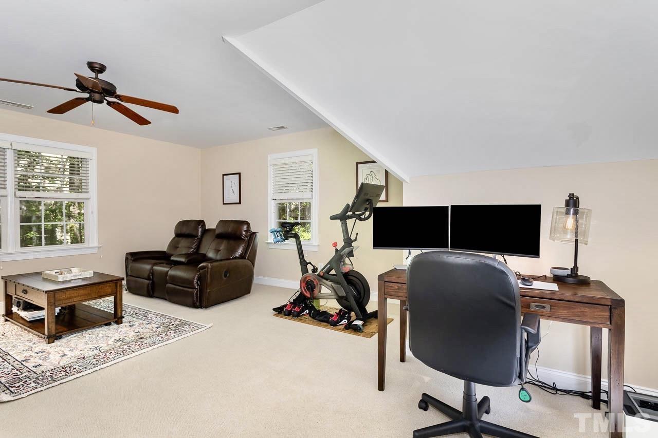 8333 Wheatstone Lane Raleigh, NC 27613 - Photo 27 of 34 a bedroom with furniture and a window