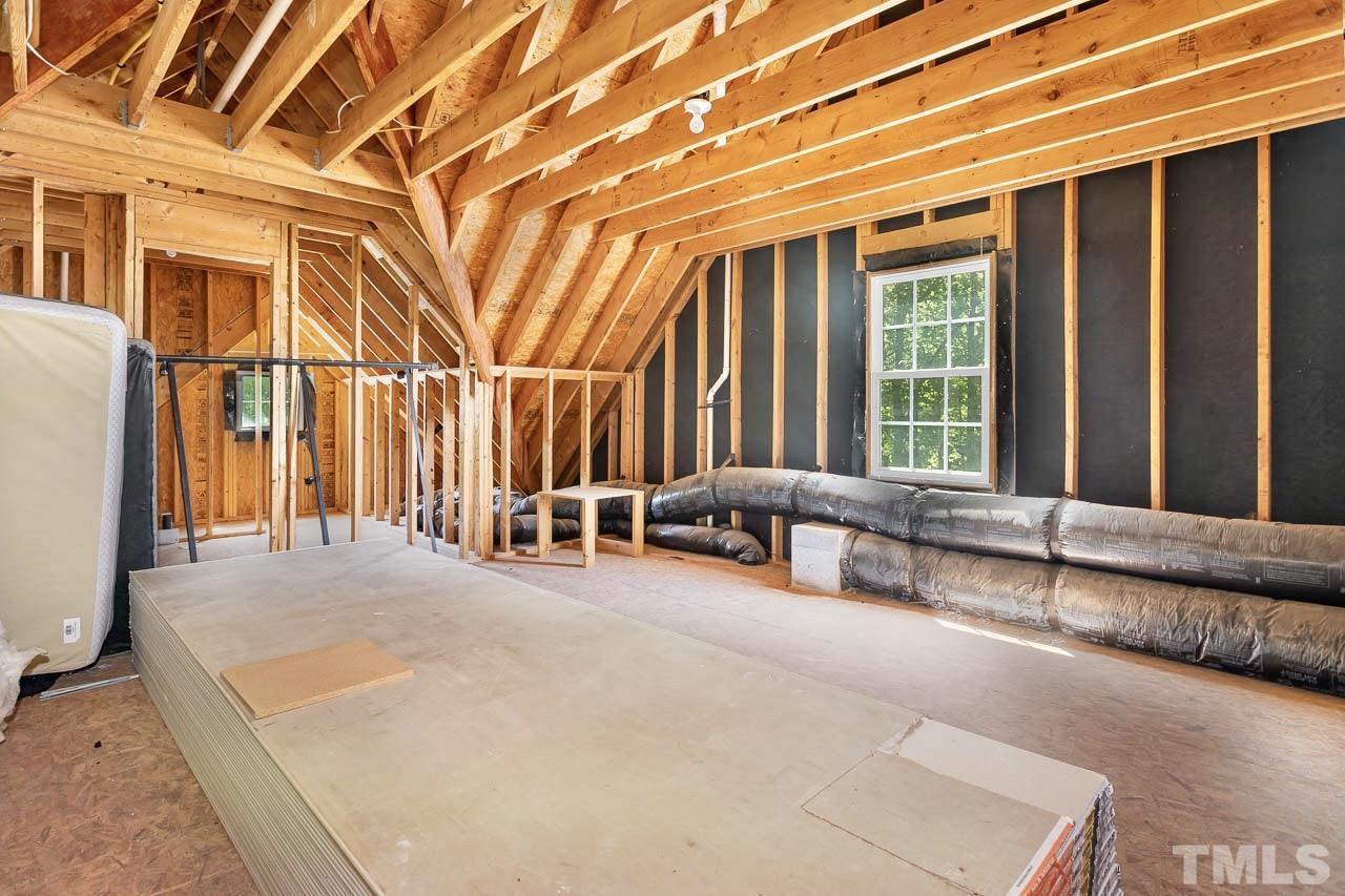 8333 Wheatstone Lane Raleigh, NC 27613 - Photo 28 of 34 a view of a patio with a table and chairs and wooden fence