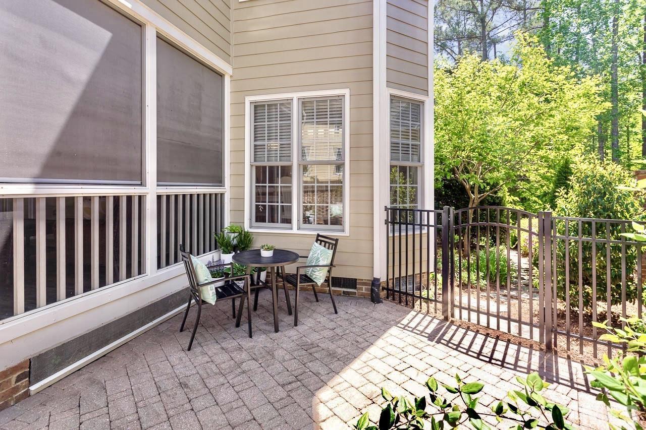 8333 Wheatstone Lane Raleigh, NC 27613 - Photo 31 of 34 a view of a two chairs and table in the porch