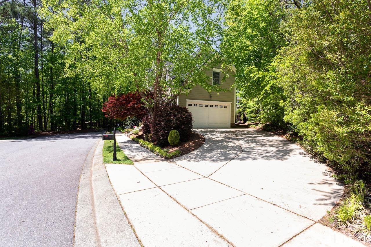 8333 Wheatstone Lane Raleigh, NC 27613 - Photo 33 of 34 a front view of a house with a yard