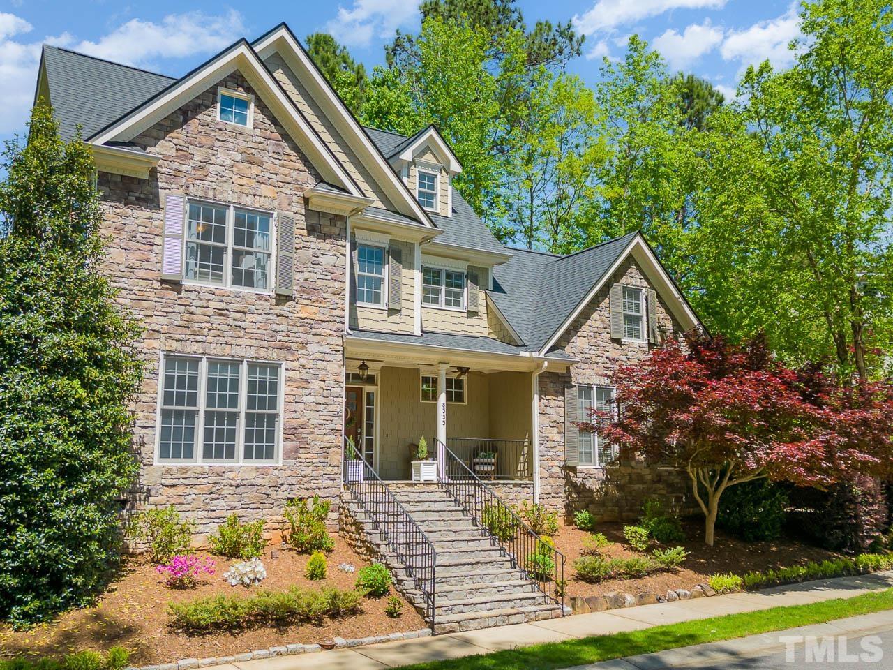 8333 Wheatstone Lane Raleigh, NC 27613 - Photo 34 of 34 a front view of a house with garden