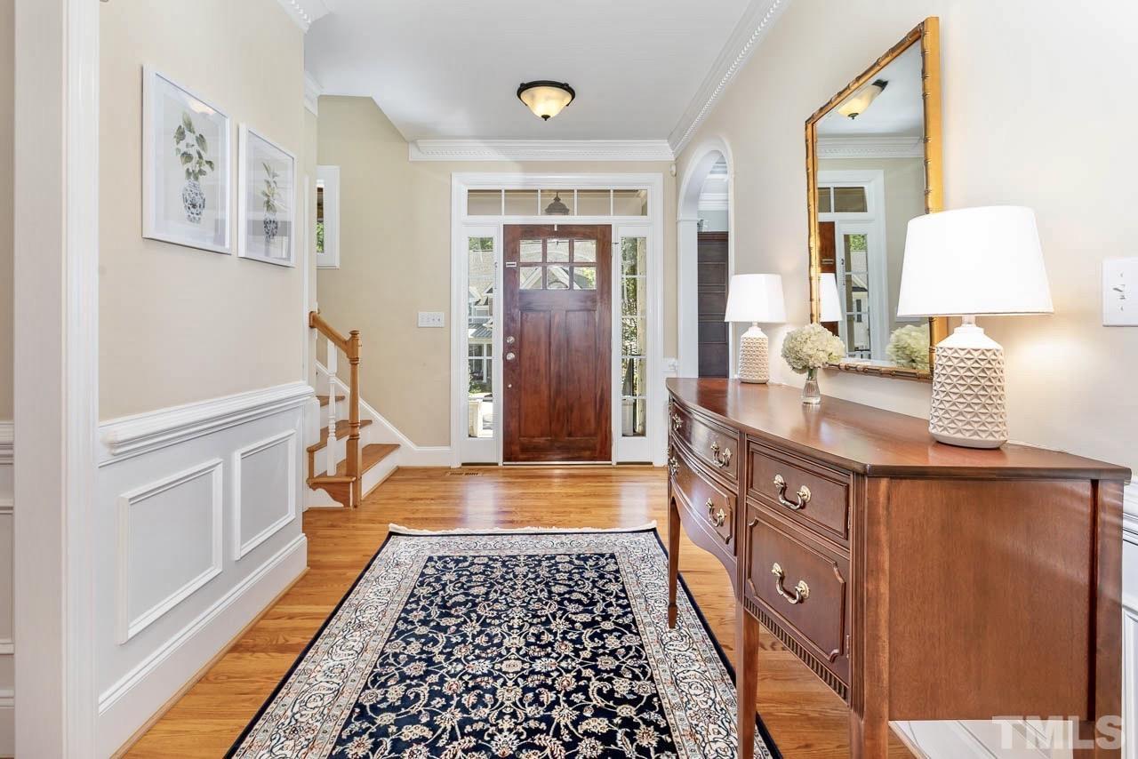 8333 Wheatstone Lane Raleigh, NC 27613 - Photo 4 of 34 a bathroom with a sink a mirror and a shower