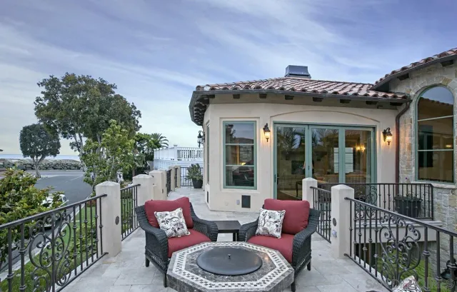 a view of a patio with couches chairs and potted plants