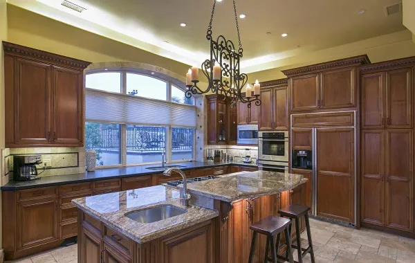a living room with a large pool table and chairs