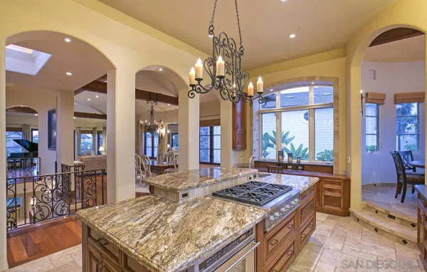 a dining room with furniture a rug and a chandelier