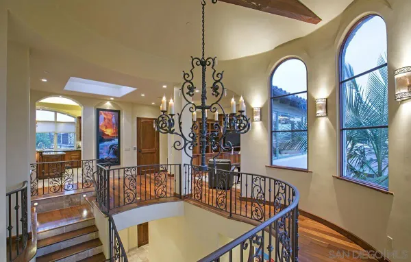 a living room with furniture a window and a table