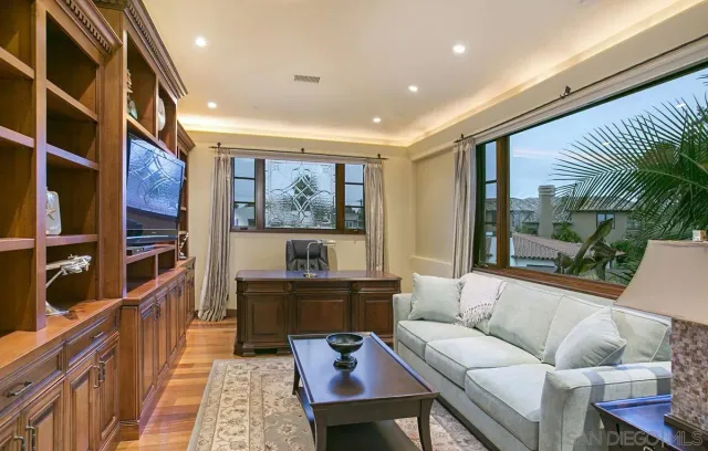 a bathroom with a granite countertop shower sink vanity and mirror