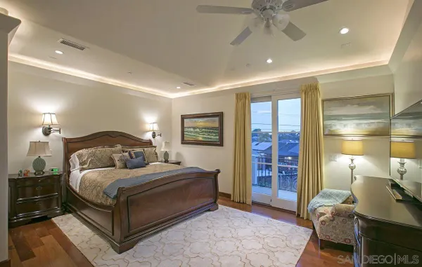 a bathroom with a granite countertop sink a large mirror and a bathtub with shower