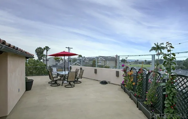 a view of a chairs and table in the patio
