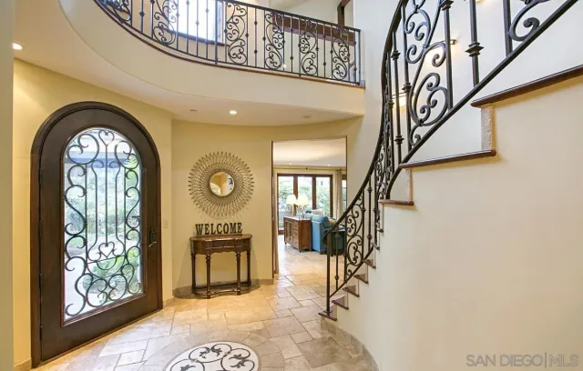 a view of entryway with a flower pot and a bookshelf