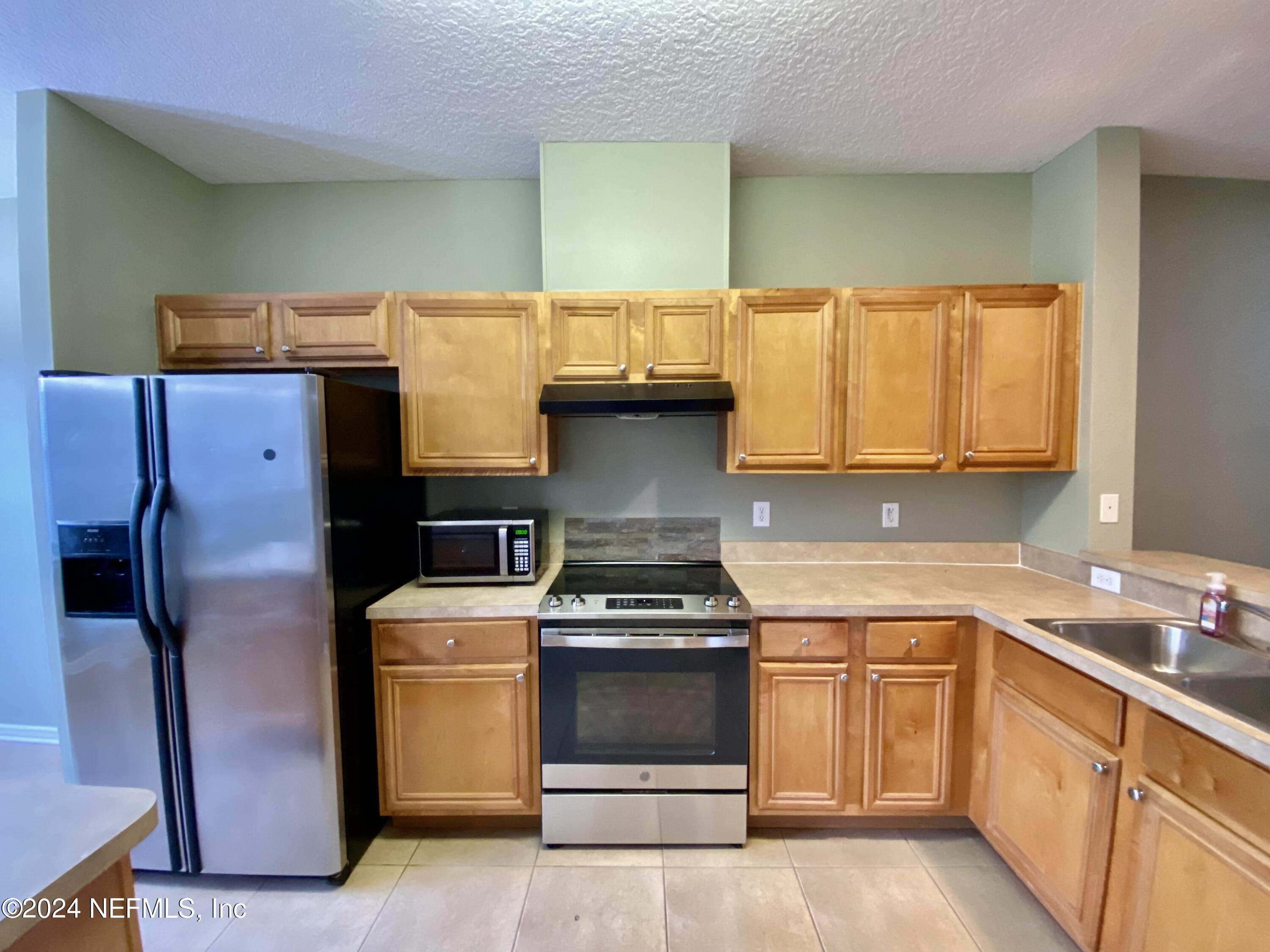5663 Greenland Road, Unit 304 Jacksonville, FL 32258 - Photo 5 of 26 IMG_2704