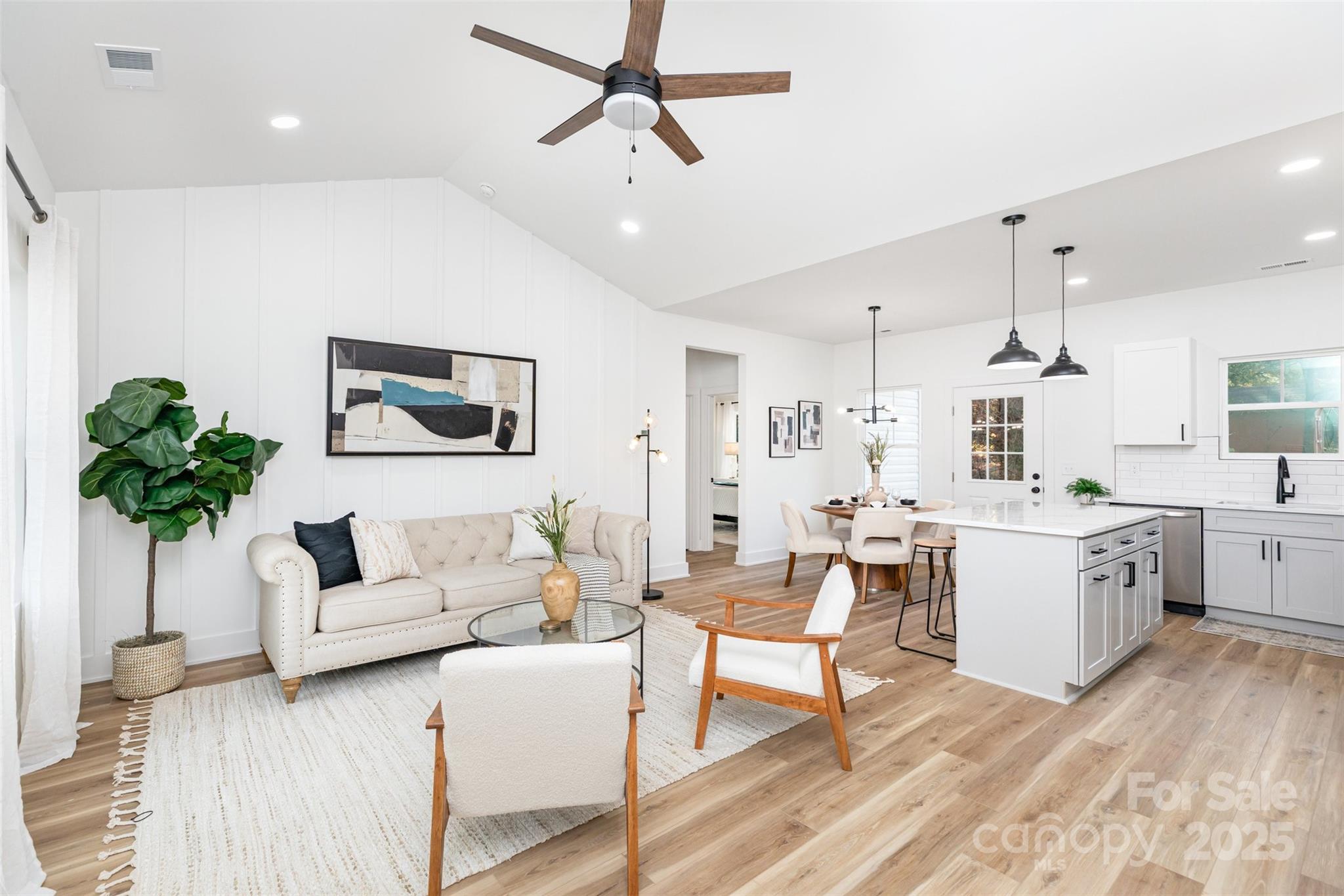 2802 Walkup Avenue Monroe, NC 28110 - Photo 2 of 16 a living room with furniture and a chandelier