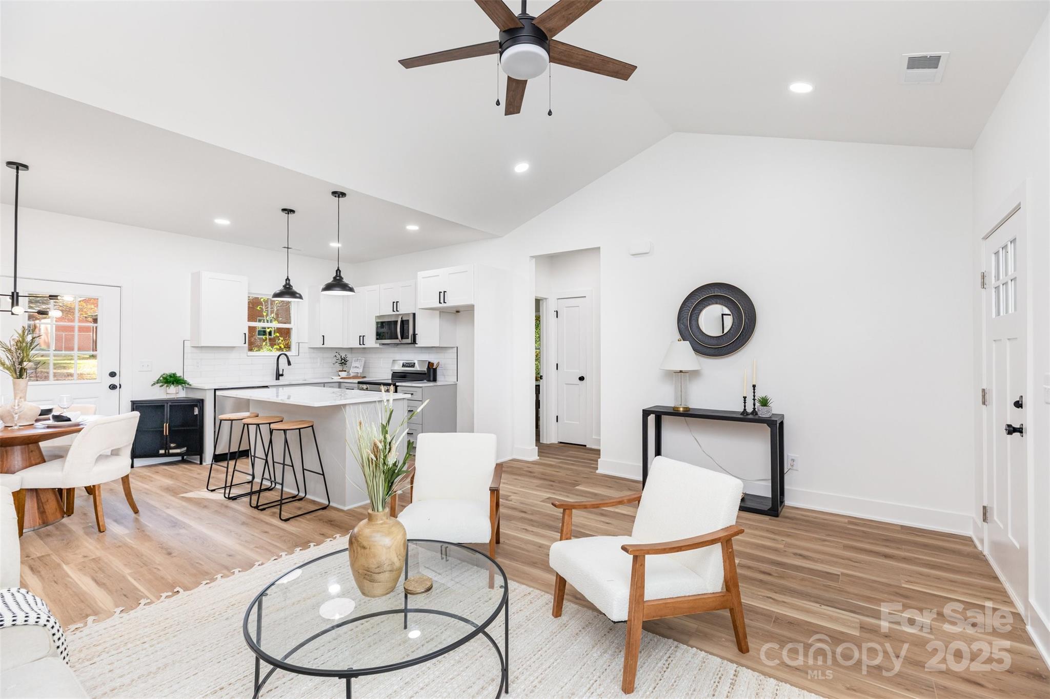 2802 Walkup Avenue Monroe, NC 28110 - Photo 3 of 16 a living room with dining room and kitchen view