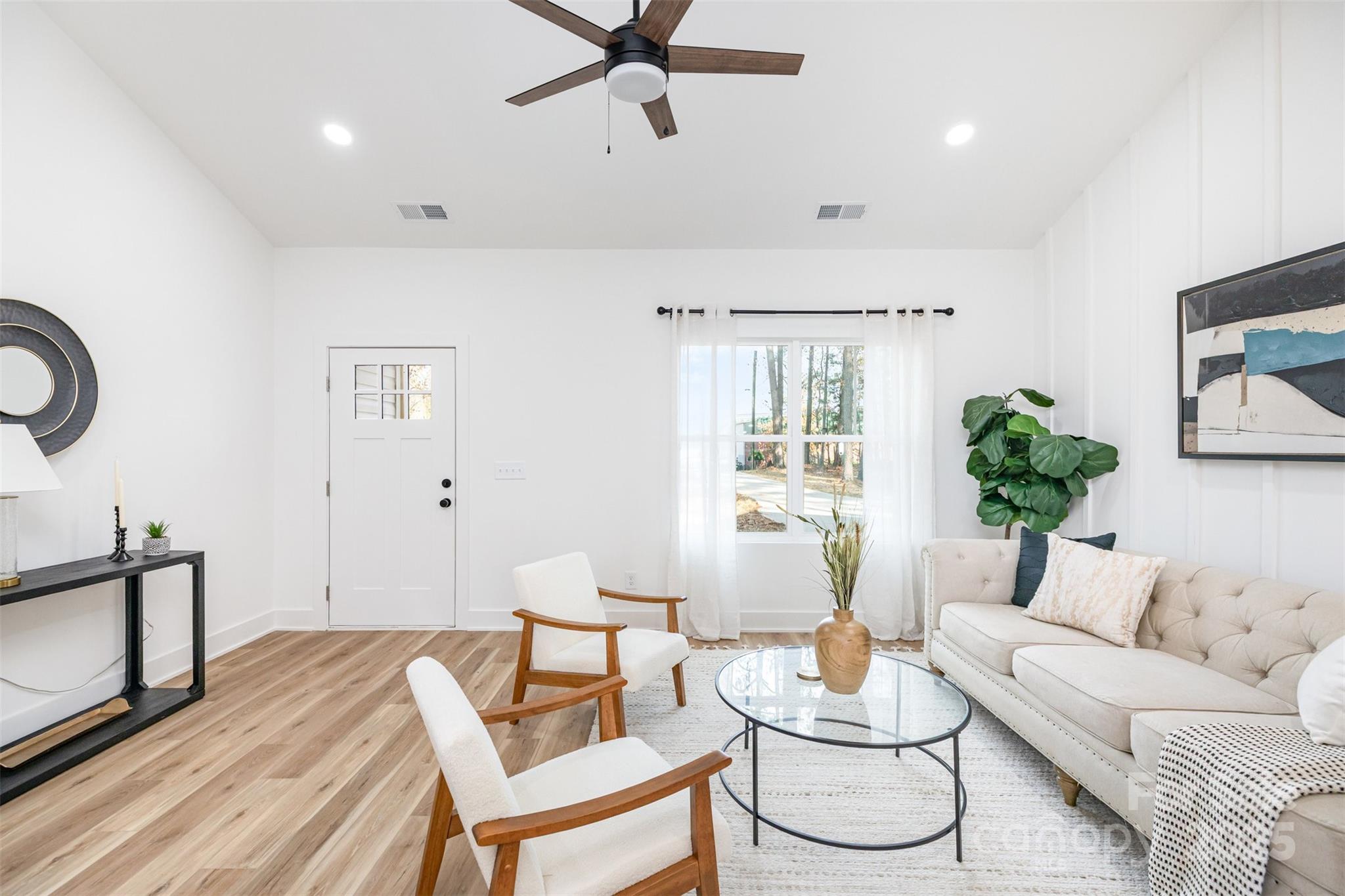 2802 Walkup Avenue Monroe, NC 28110 - Photo 4 of 16 a living room with furniture and a potted plant